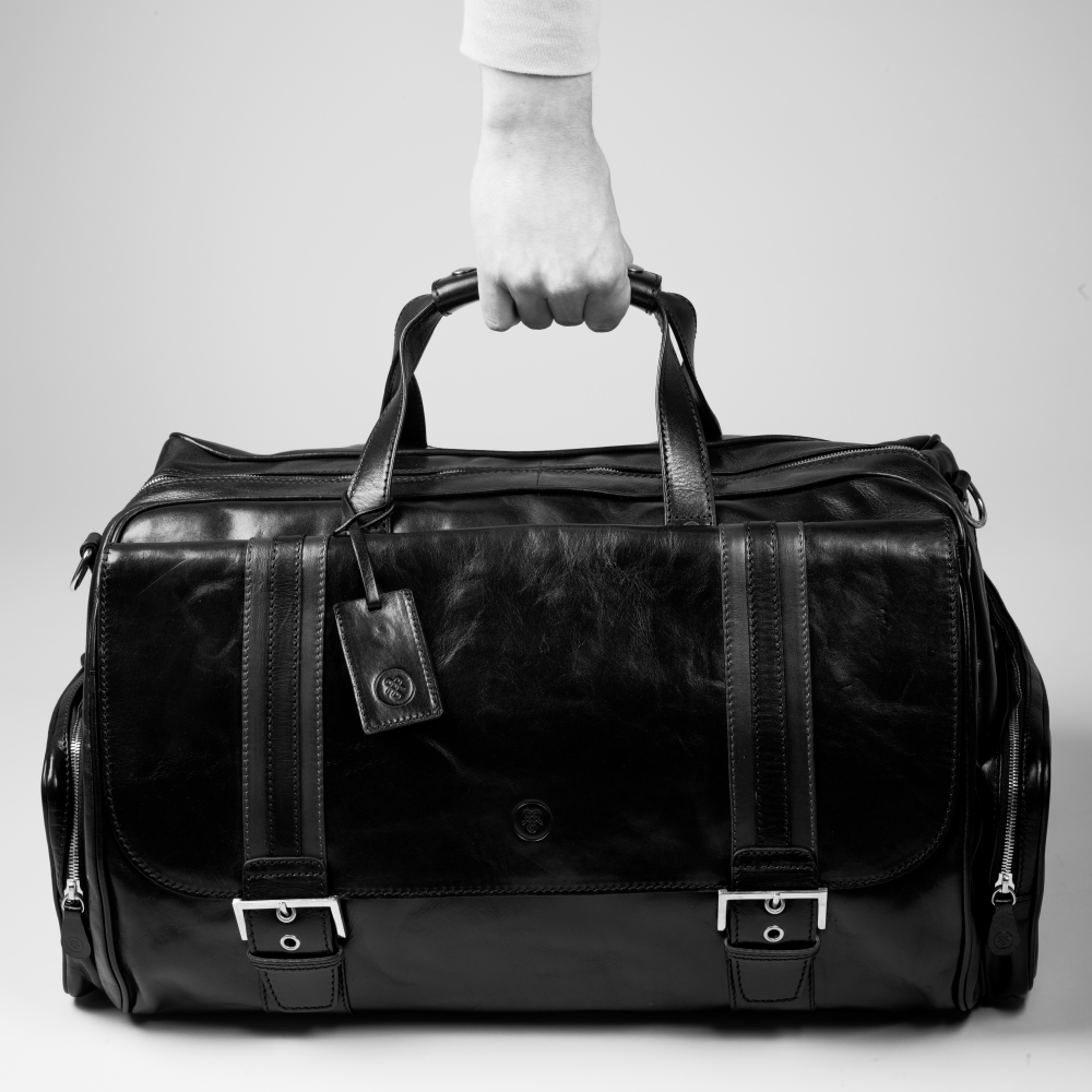 Black and White image of DinoM in Black being held