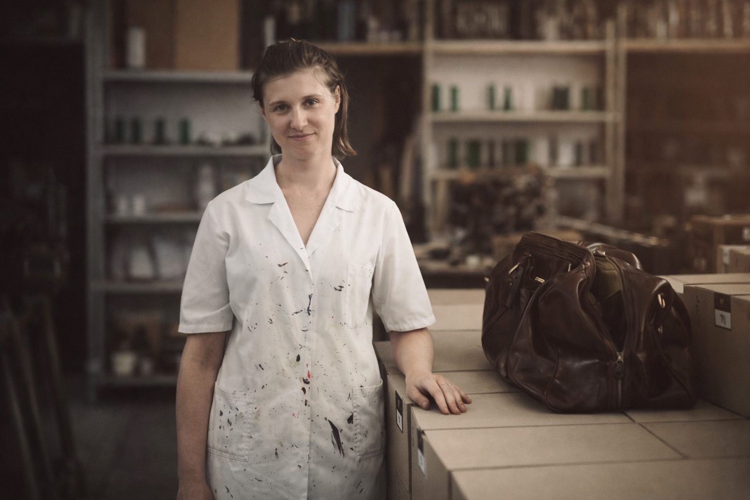 italian leather craftsman with handmade leather bag