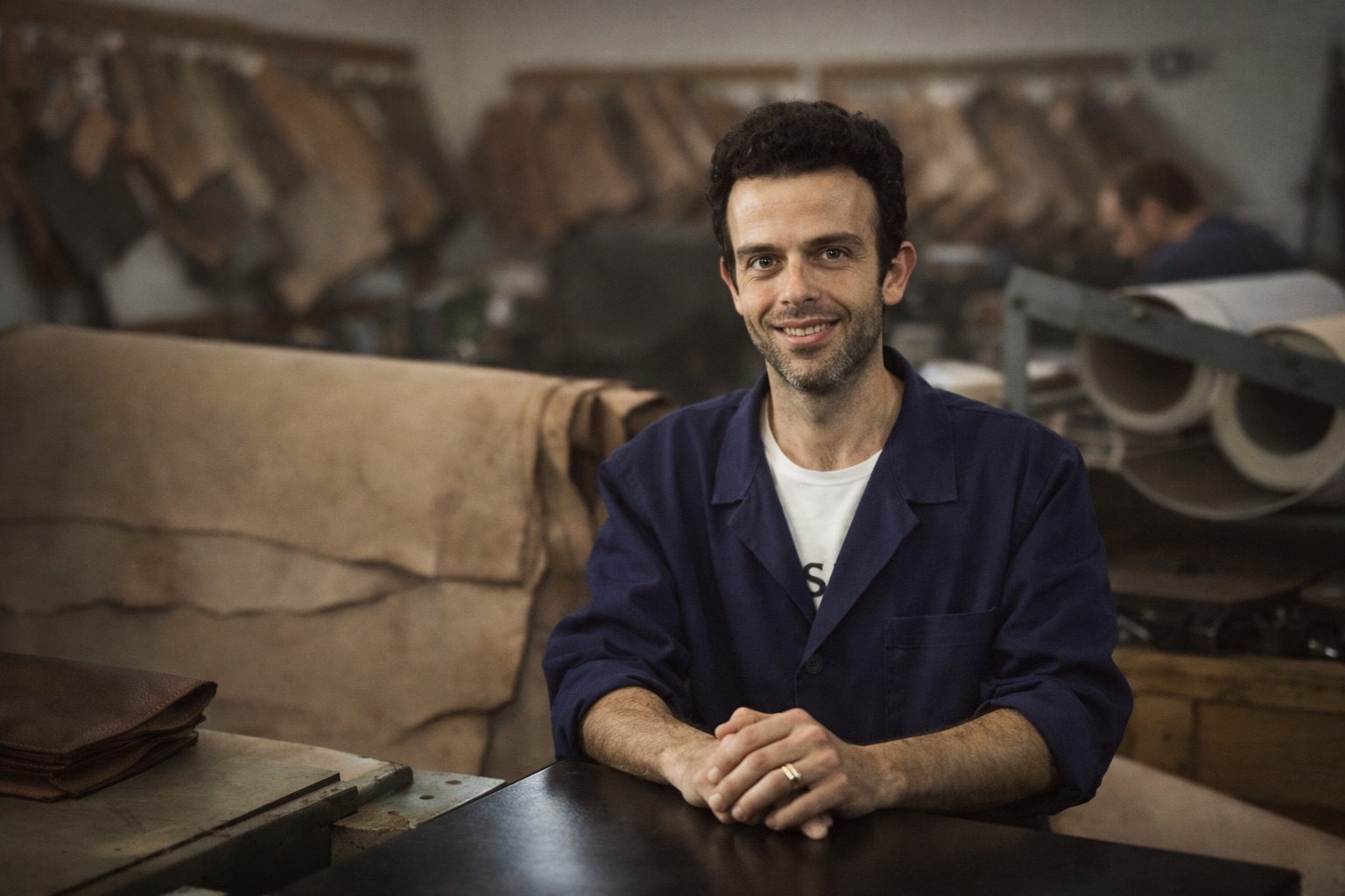 italian leather artisan in factory workshop