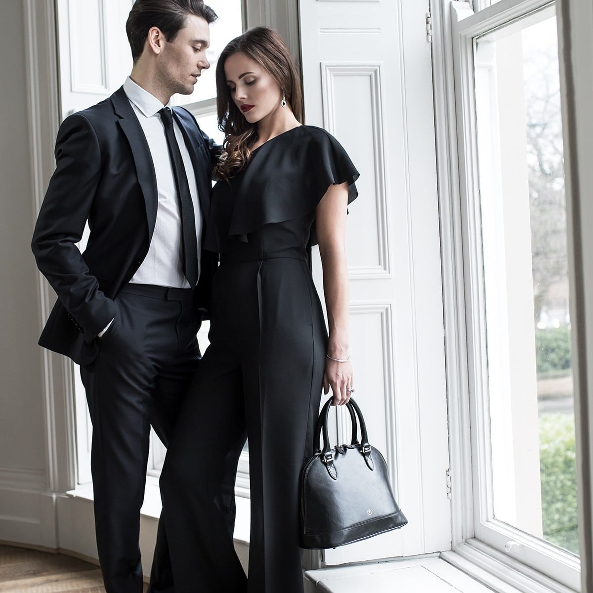 Couple infront of Window all black