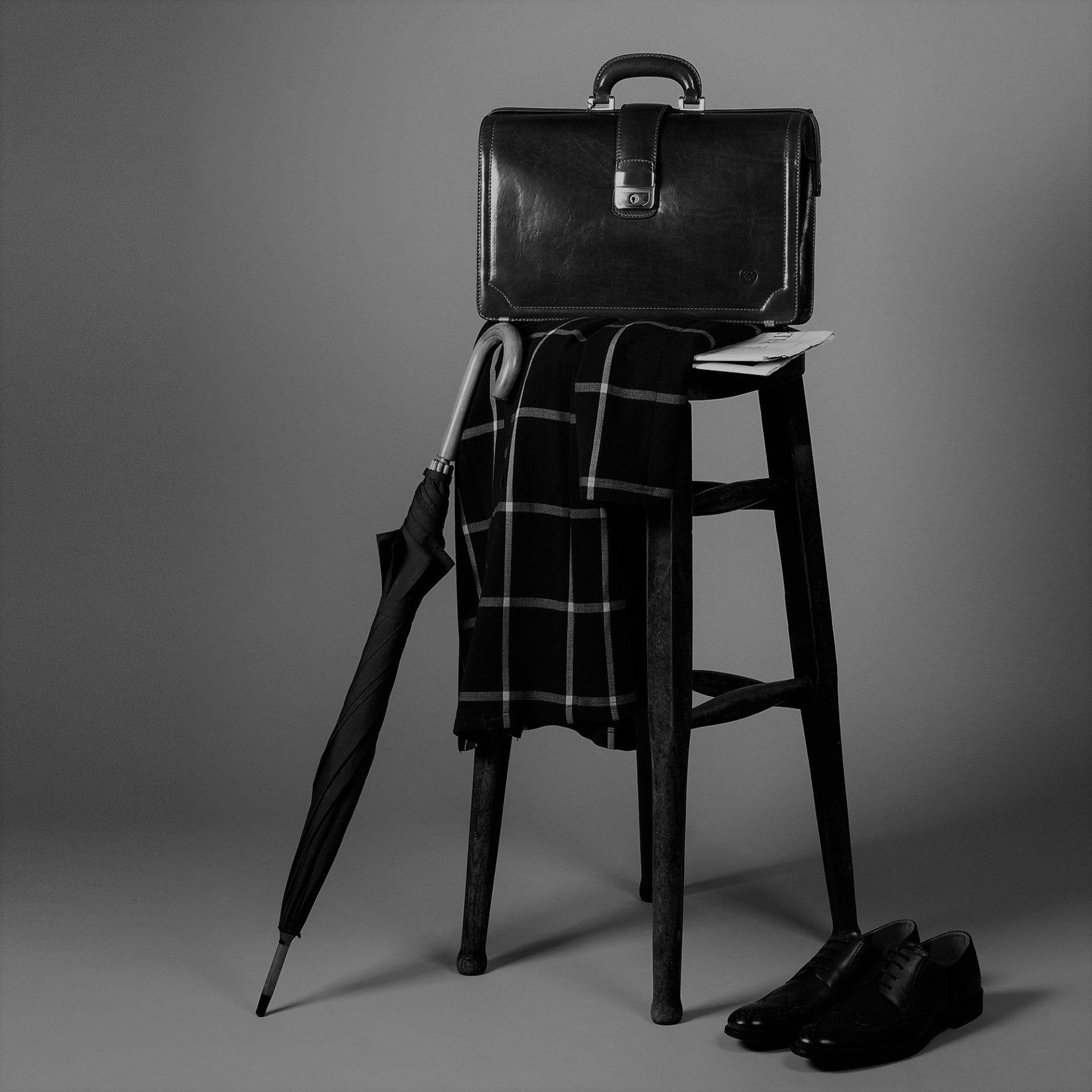 Full-grain leather briefcase with structured silhouette and refined detailing