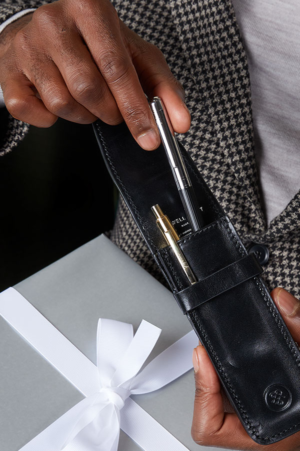 Black Pienza Penholder next to Gift Wrapping