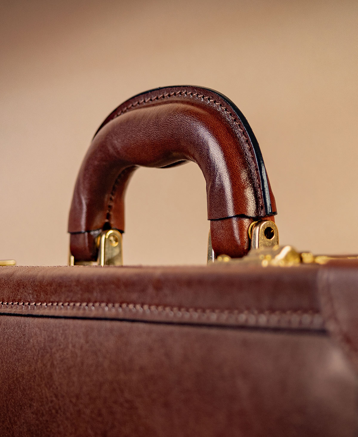 Structured leather attaché with carry handle