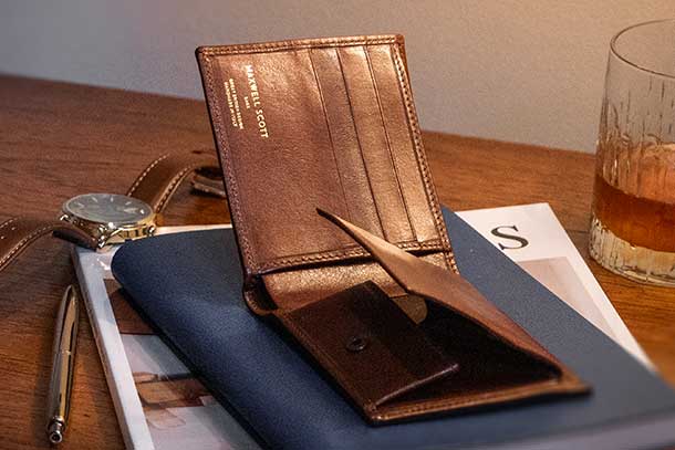 best mens leather RFID wallet on desk with magazine