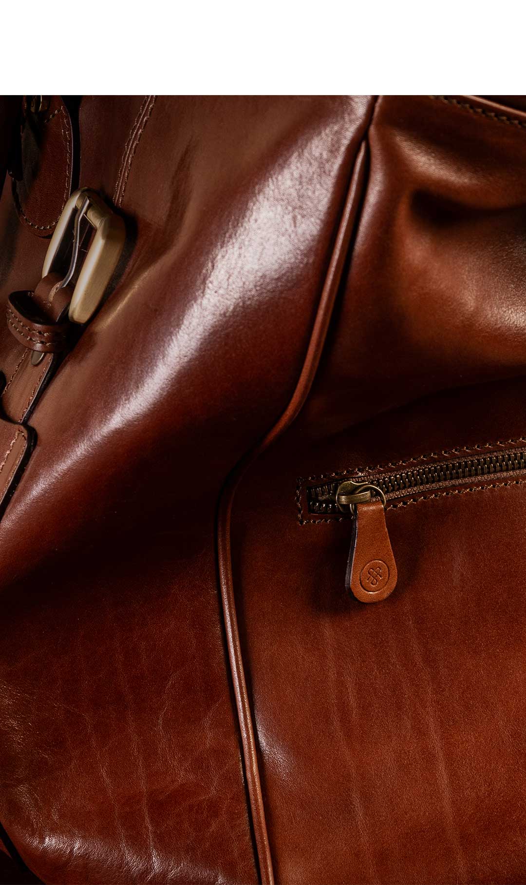 side shot of luxury leather travel bag for men in tan