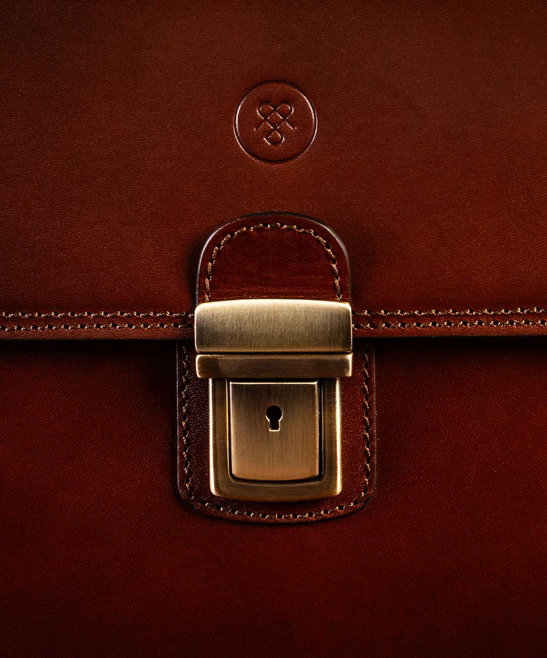 Paolo leather briefcase brushed brass Alce lock detail