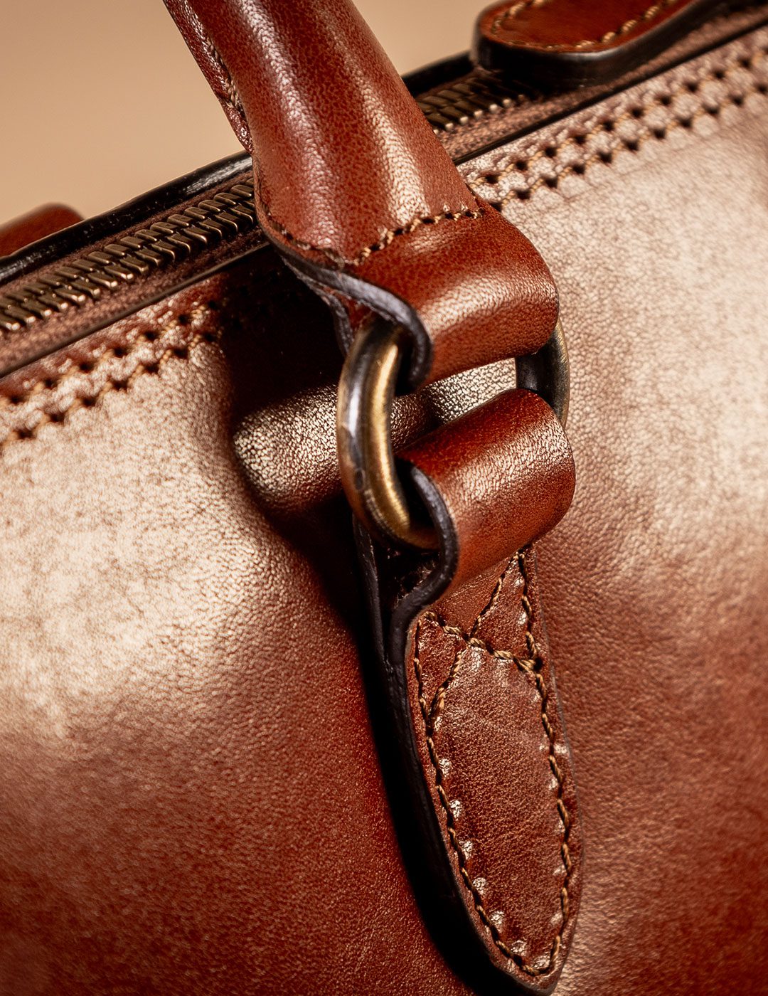 handle from ladies luxury italian leather handbag in brown