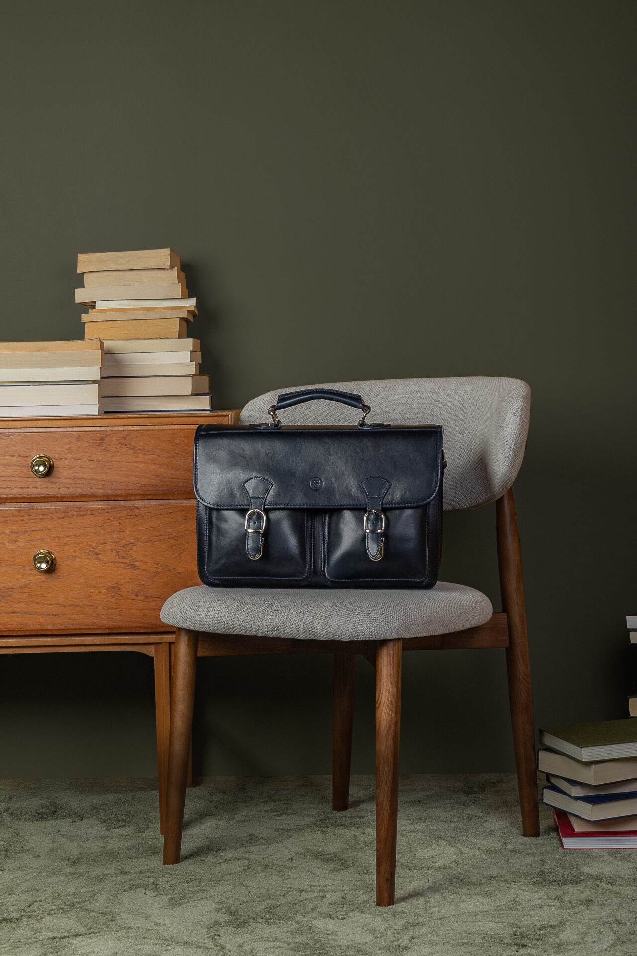 Black Loreto leather laptop bag on chair