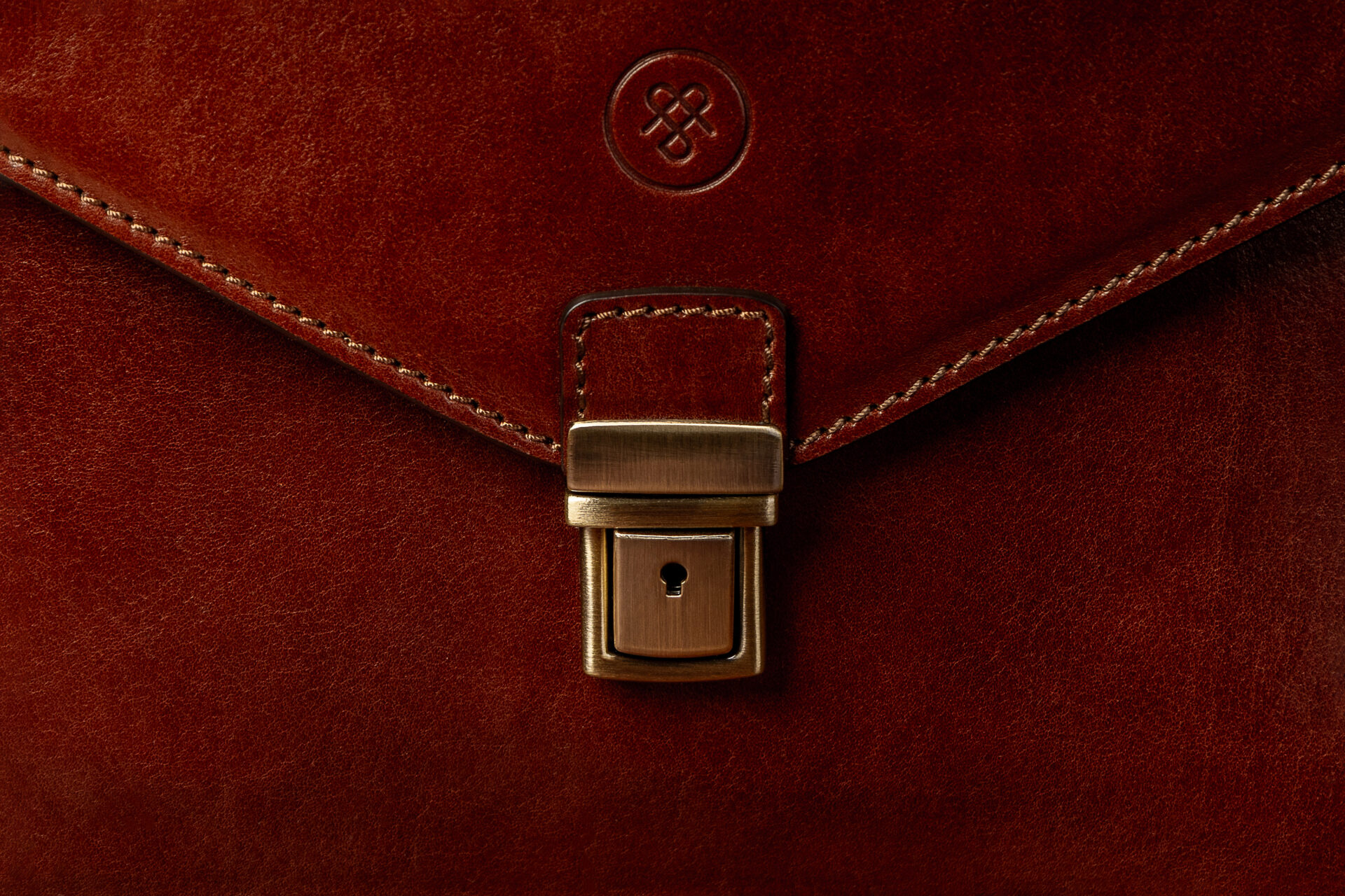 Close-up of Lorenzo leather briefcase showing fine Italian leather grain