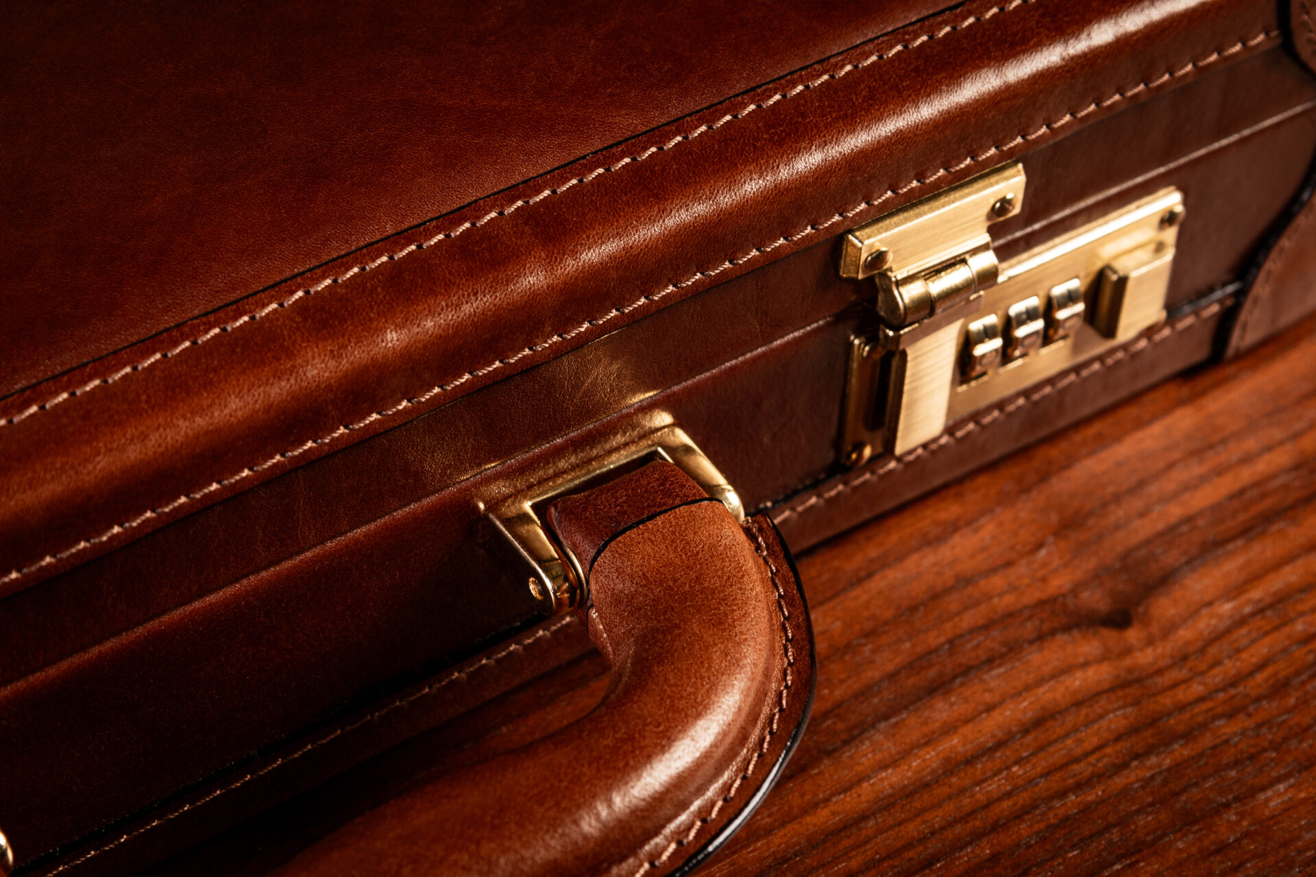 Close-up detail of the Scanno attaché case brass combination locks