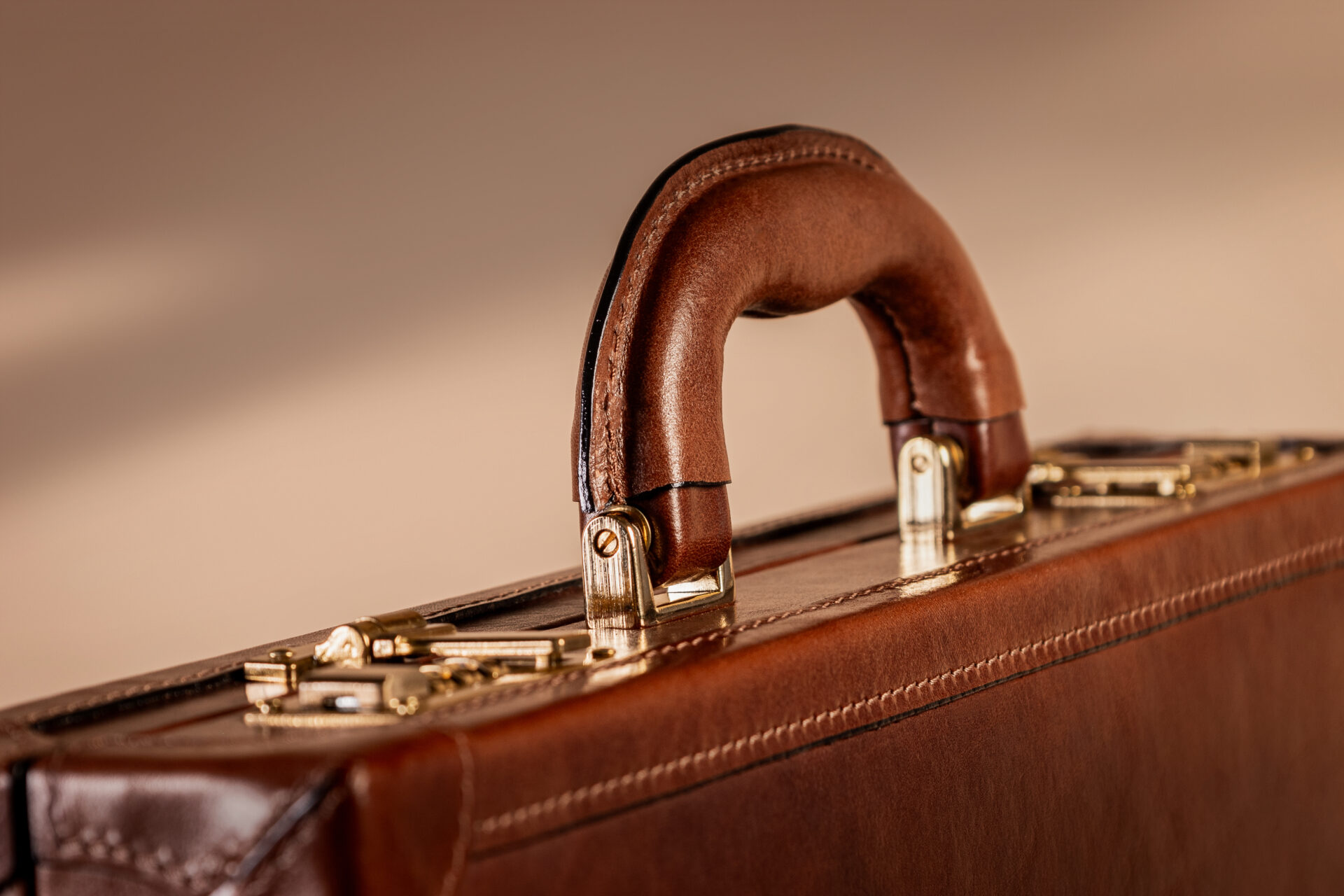 Twin combination lock briefcase with brushed brass Cagiva hardware